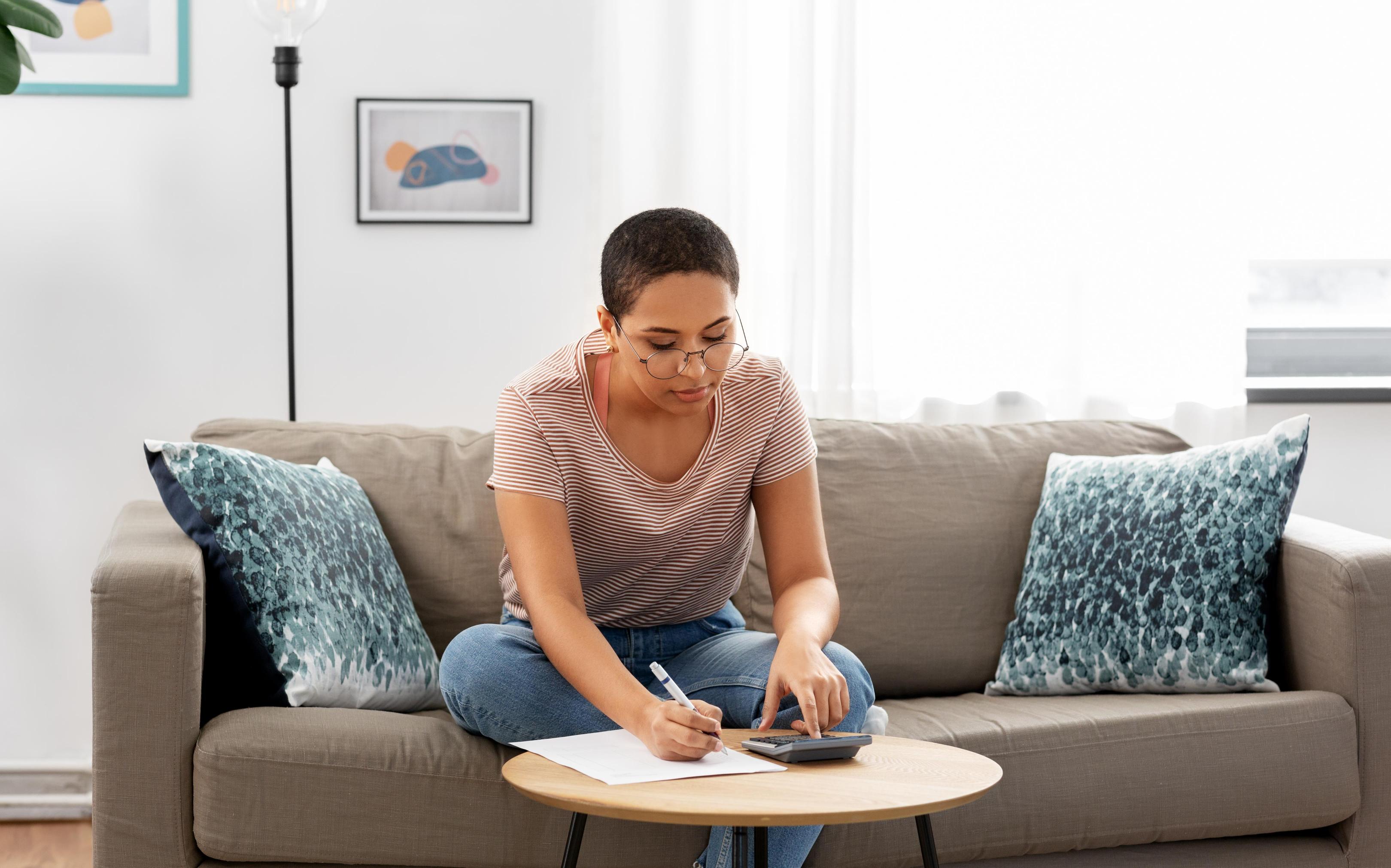 Woman planning budget at home
